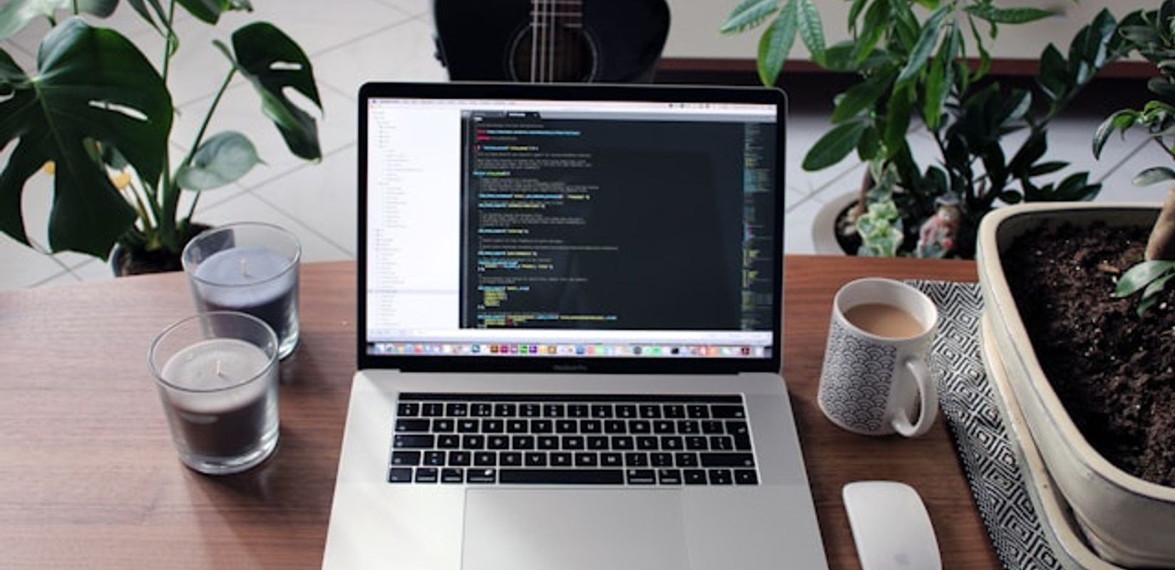 Custom-coded website development on a laptop in a modern office setting for small business growth.