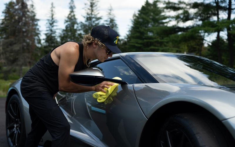 Construction team with drill working on a residential roof for local trade services
